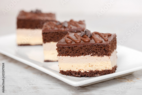 Chocolate and cream cake on plate