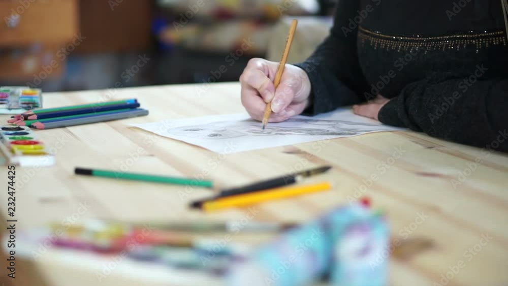 Table where the artist draws an owl Table where the artist draws an owl