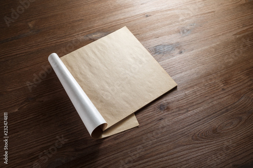 Mock-up brochure or catalog on wood table background. Blank kraft paper pages.
