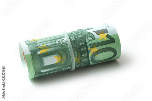 closeup of banknotes roll of hundred euros money on white background