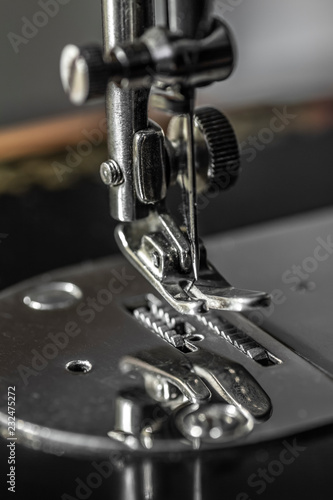 Sharp needle off sewing machine close up.