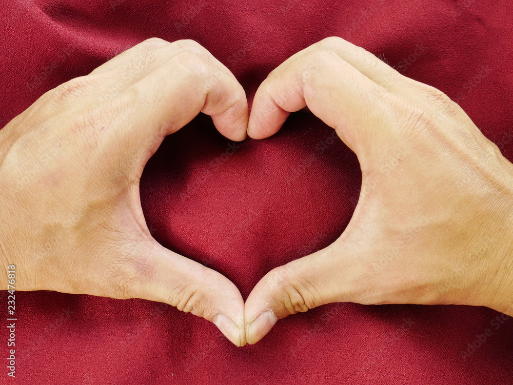 human hand on red cloth,cotton fabric background,red silk satin human hand on red cloth,cotton fabric background,red silk satin