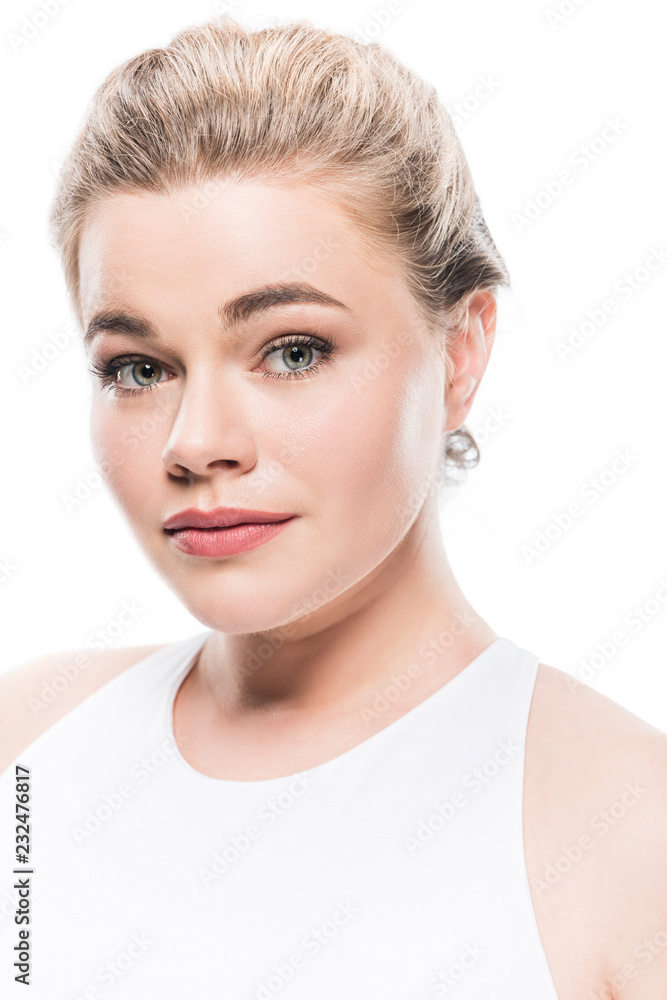 Obraz premium portrait of beautiful young woman looking at camera isolated on white