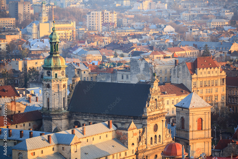 Fototapeta premium Old town with a church in the center, Lviv city, Ukraine. Bell Tower of the Bernardine Monastery.