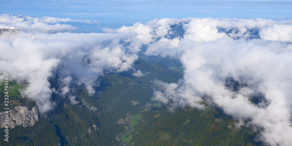 Mountain green valley under the clouds. Jungfrau region in Switzerland.