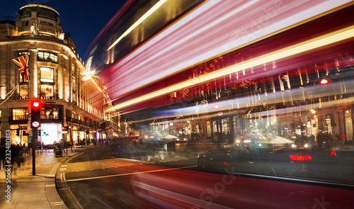 night scene of London city with moving red bus and cars - long exposure photography