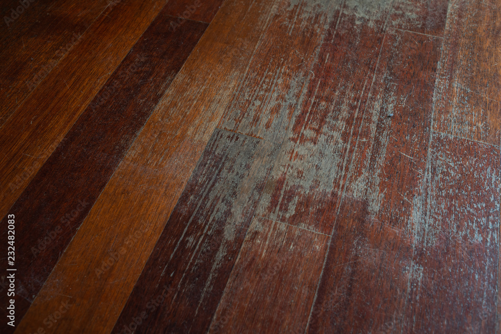Old scratched hardwood flooring in need of maintenance. parquet ruined by scratches made by prolonged use of chair. - obrazy, fototapety, plakaty 