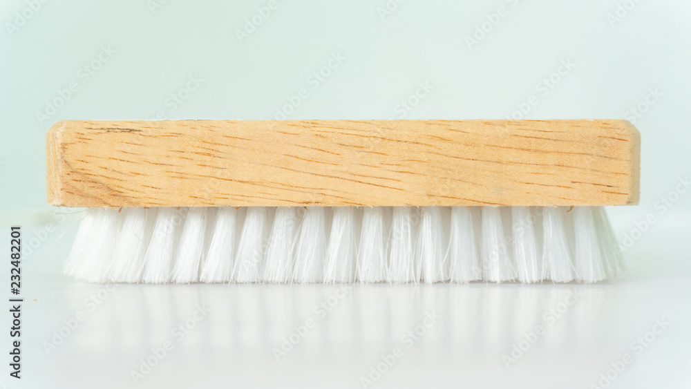 Washing brush use for cleaning cloth on white background Washing brush use for cleaning cloth on white background
