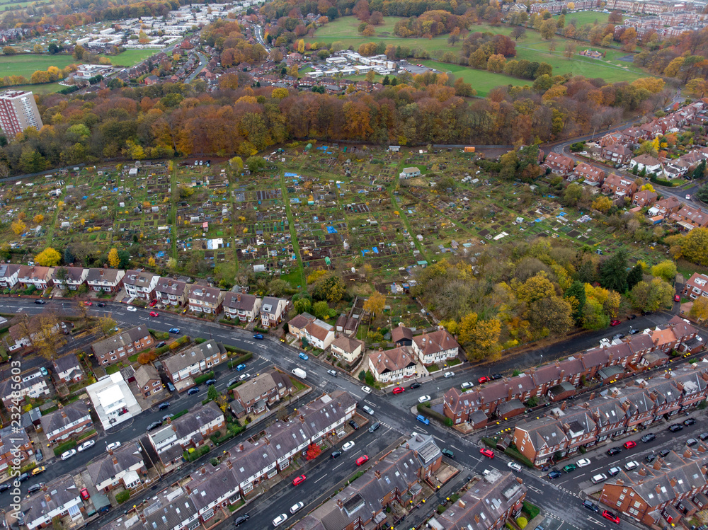 Aerial photo of a typical town in the UK showing rows of houses, paths & roads, taken over Headingley in Leeds, which is in West Yorkshire in the UK. - obrazy, fototapety, plakaty 