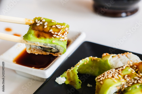 Sushi roll with eel and avo...
