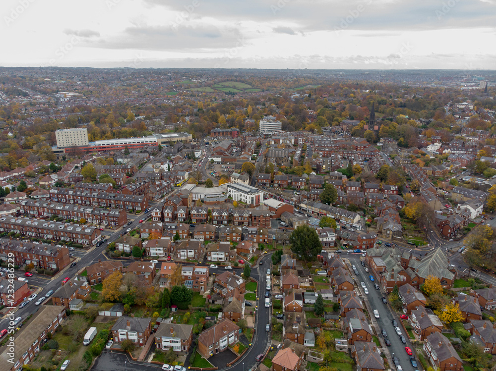 Obraz premium Aerial photo of a typical town in the UK showing rows of houses, paths & roads, taken over Headingley in Leeds, which is in West Yorkshire in the UK.