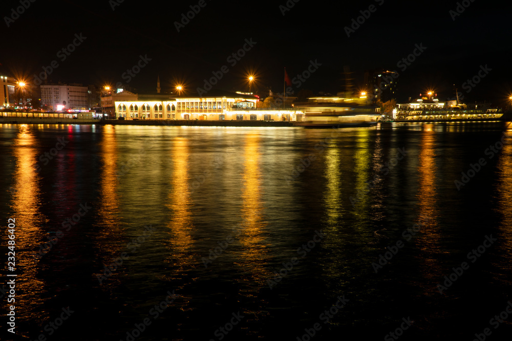 Long exposured city lights on sea surface at Istanbul Kadikoy