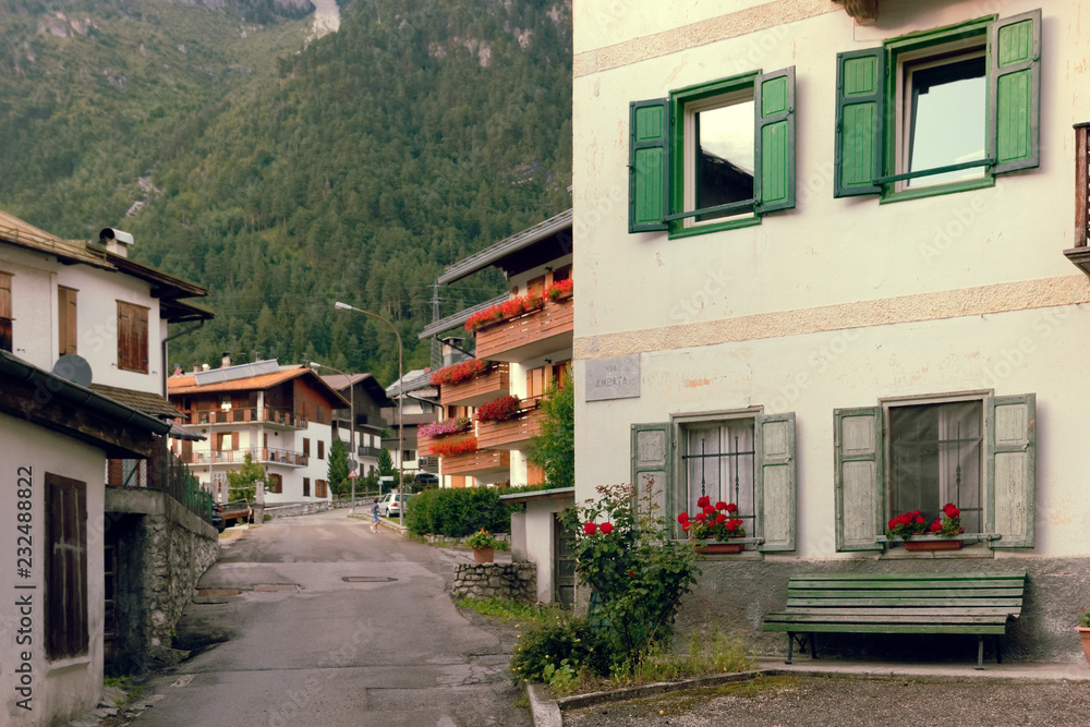Beluno, Italy August 9, 2018: Auronzo di Cadore mountain village. Houses on the mountains.