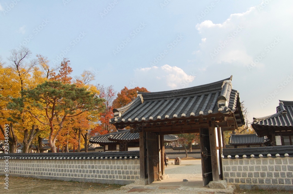 Traditional korean wall and gate in the Jeonju Hanok Village in autumn Traditional korean wall and gate in the Jeonju Hanok Village in autumn