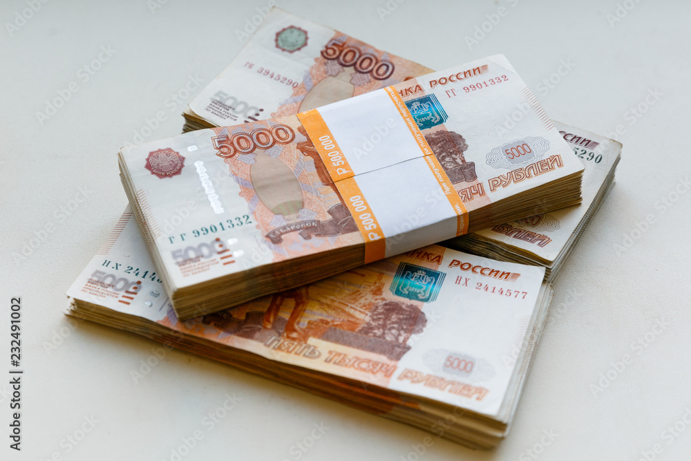 Russian rubles isolated on white background, packed stack of banknotes 5000 rubles Russian rubles isolated on white background, packed stack of banknotes 5000 rubles