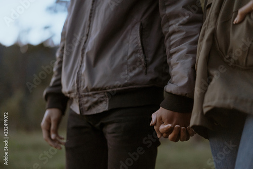 woman and man hand holding together
