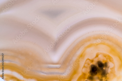 Close up of natural yellow agate crystal surface, yellow agate crystal cross section. abstract background texture.