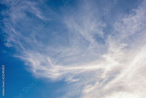 White soft fluffy clouds  scatter over blue sky background. Beautiful soft white clouds in clear blue sky  the end of rainy season.