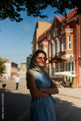 Girl in a sense of happiness and joy walks in the city