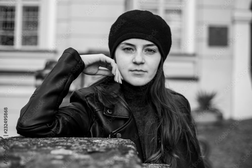 Beautiful girl in a leather jacket in the old place Beautiful girl in a leather jacket in the old place
