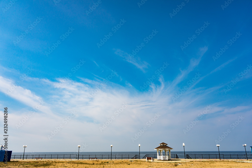Fototapeta premium view of beach with blue sky and clouds