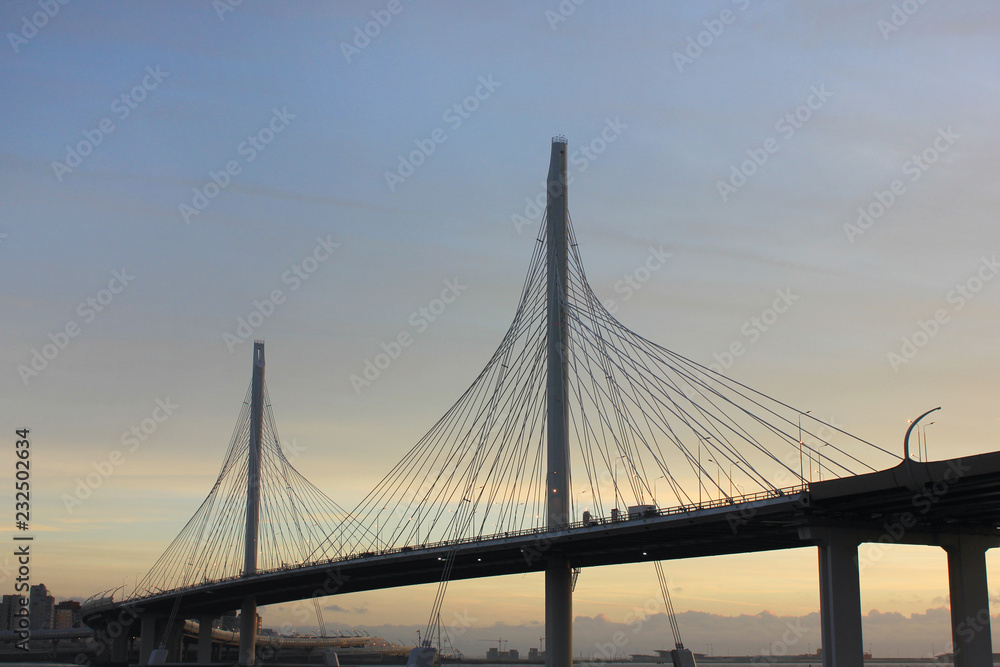 Obraz premium Western Rapid Diameter Highway and Cable-Stayed Bridge Over Neva River in Saint Petersburg, Russia. Newly Built Modern City Western High Speed Diameter (WHSD) Toll Motorway View with Empty Sky