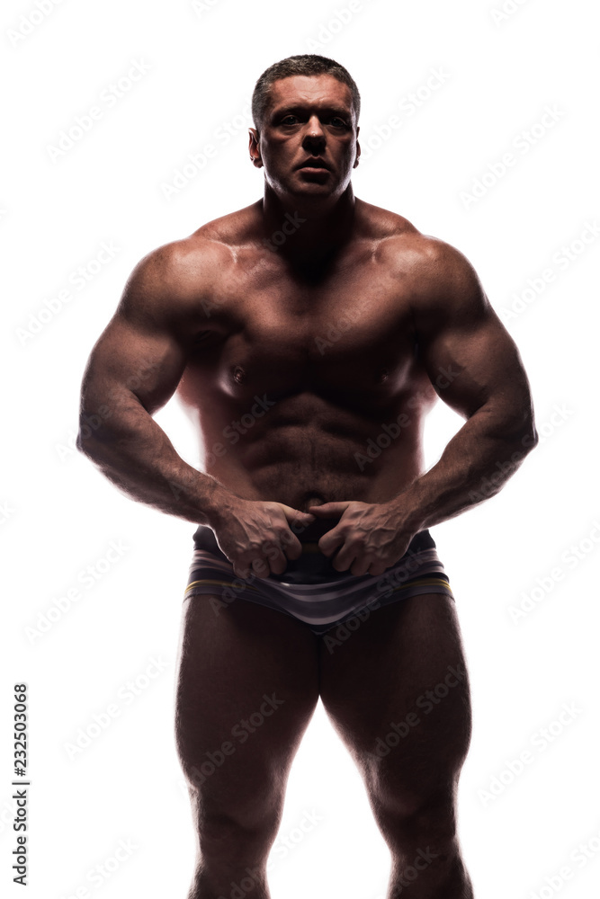 large powerful man showing his muscles in the Studio without a shirt on white background