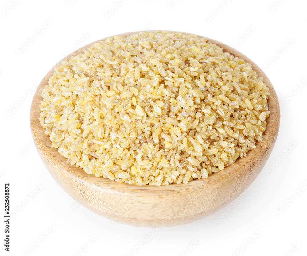 Uncooked bulgur in wooden bowl isolated on white background with clipping path Uncooked bulgur in wooden bowl isolated on white background with clipping path