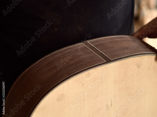 The lower body of a classical guitar.