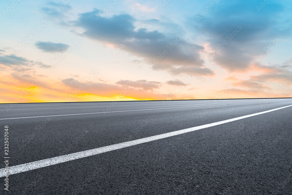 Empty highway asphalt pavement and sky cloud landscape..