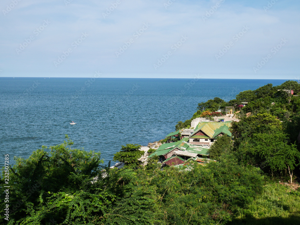 Fishing village on the hillside on the seashore in summertime.