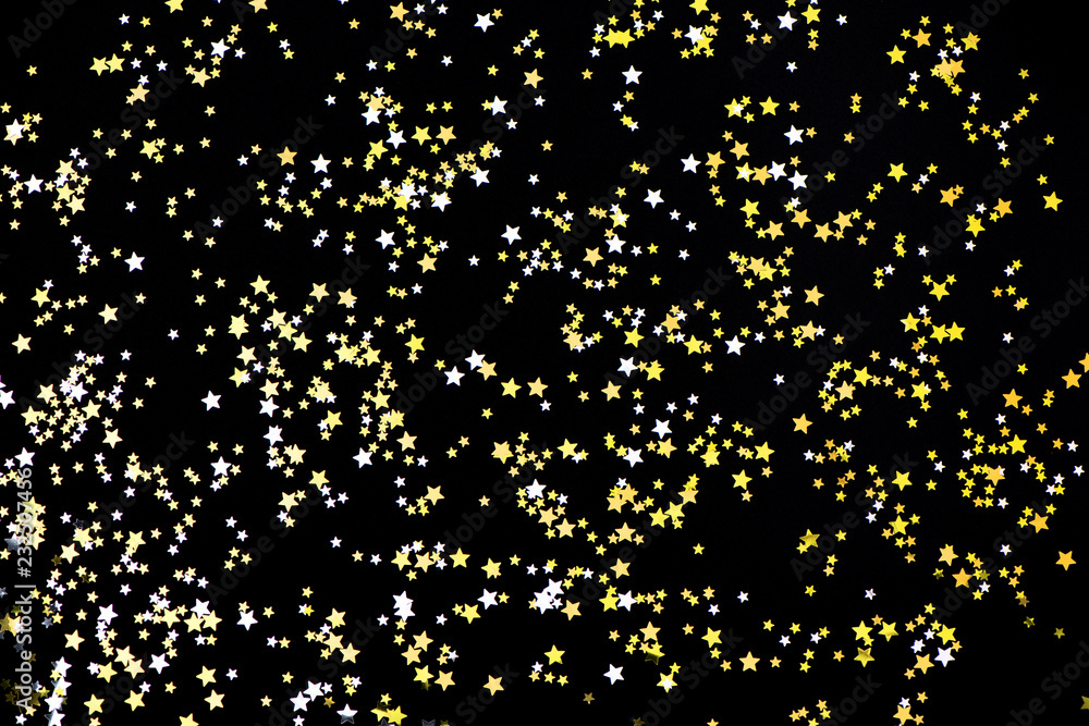 Gold and silver stars on black background Gold and silver stars on black background
