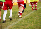 Young soccer players running