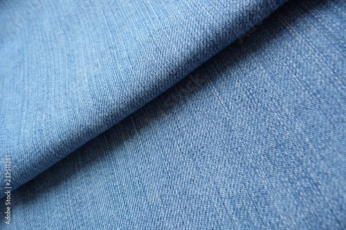 Denim blue jeans close-up macro background for decor natural canvas cotton fabric