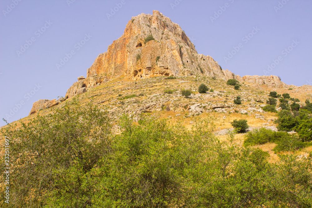 The rock face of mount Arbel in the Valley of The Doves in Israel