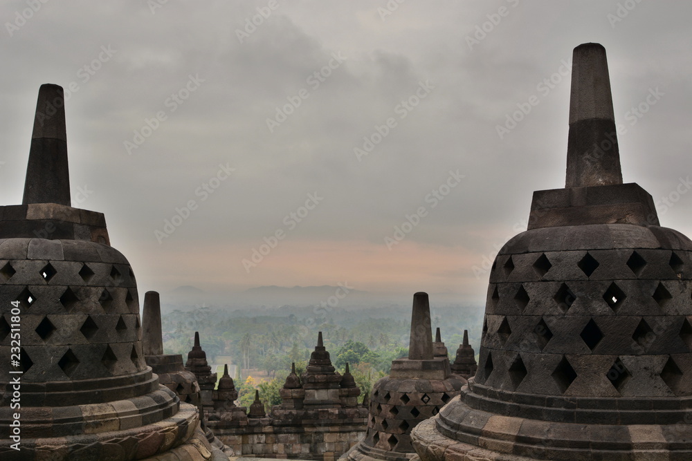 Cloudy sunrise at Candi Borobudur. Magelang. Central Java. Indonesia