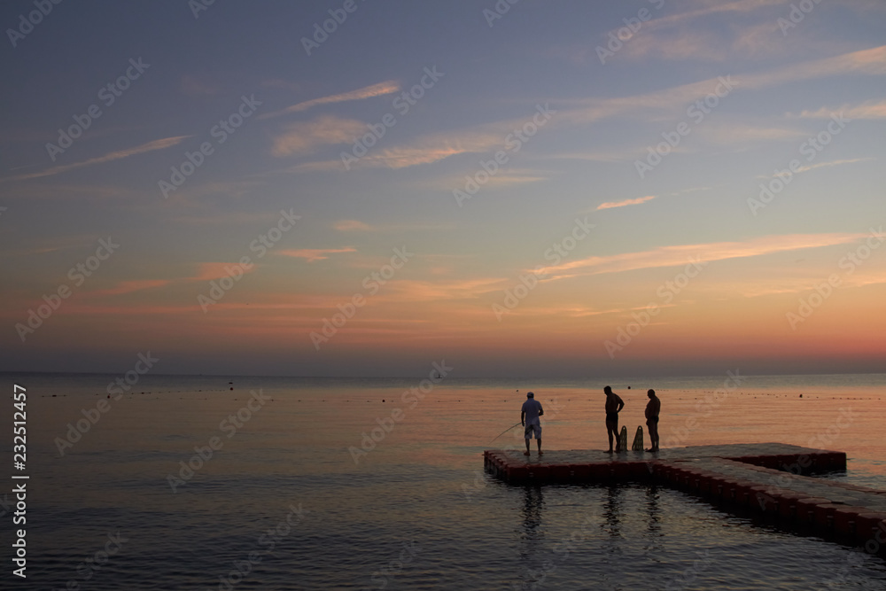 Fishermen catch fish at dawn