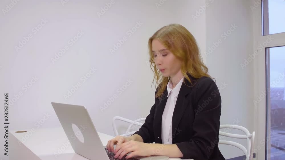 Business woman sitting on workplace using laptop computer for work in office Business woman sitting on workplace using laptop computer for work in office