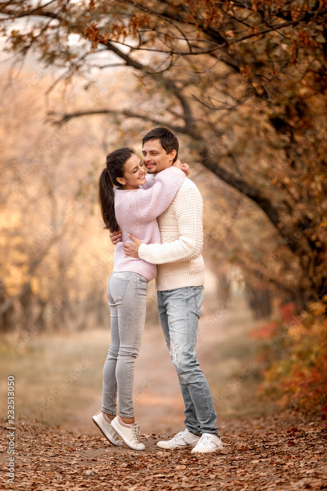 Couple in love in the autumn leaves Couple in love in the autumn leaves