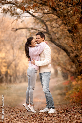 Couple in love in the autumn leaves © producer