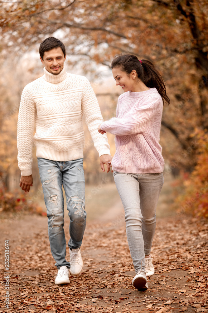 Couple in love in the autumn leaves Couple in love in the autumn leaves