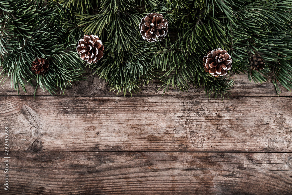 Holiday background of Christmas fir branches, spruce, pine cones. Xmas and New Year theme. Flat lay, top view Holiday background of Christmas fir branches, spruce, pine cones. Xmas and New Year theme. Flat lay, top view
