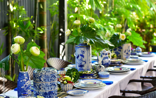 Traditional Thai utensils in contemporary table setting outdoor during day time, Thai fine dining 