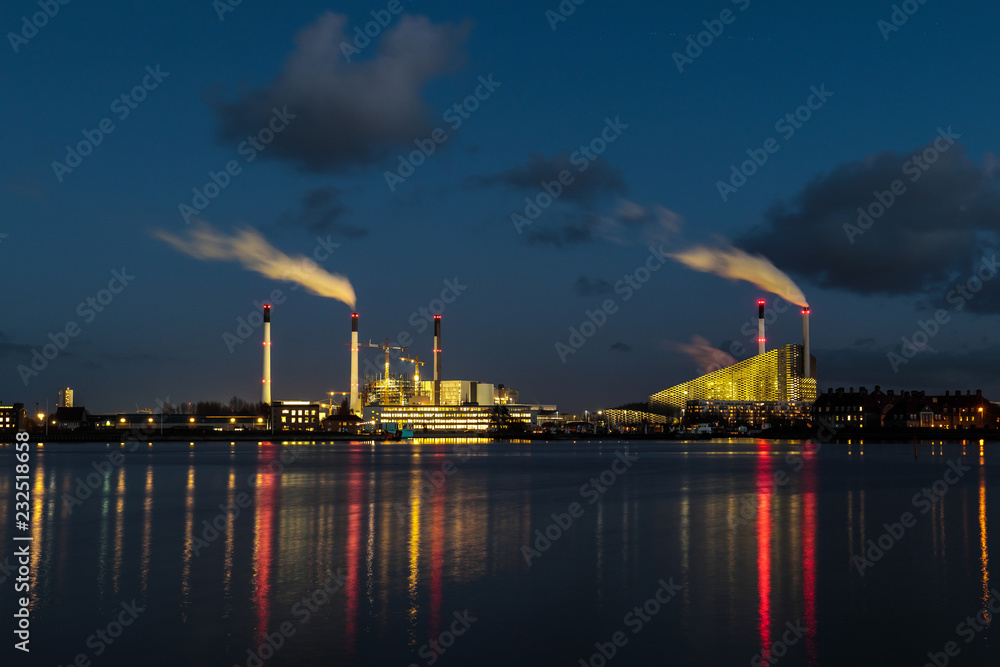 factory near the river at dusk