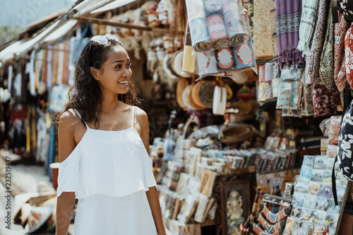 Wall Mural tourist looking at the souvenir shop