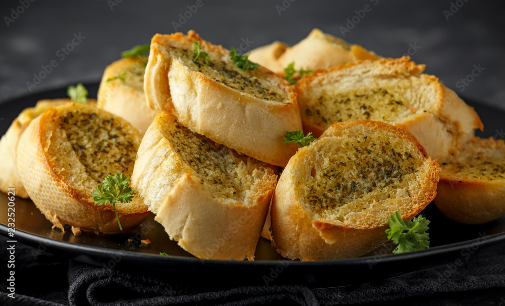 Fresh Garlic Bread bread, toast on black plate