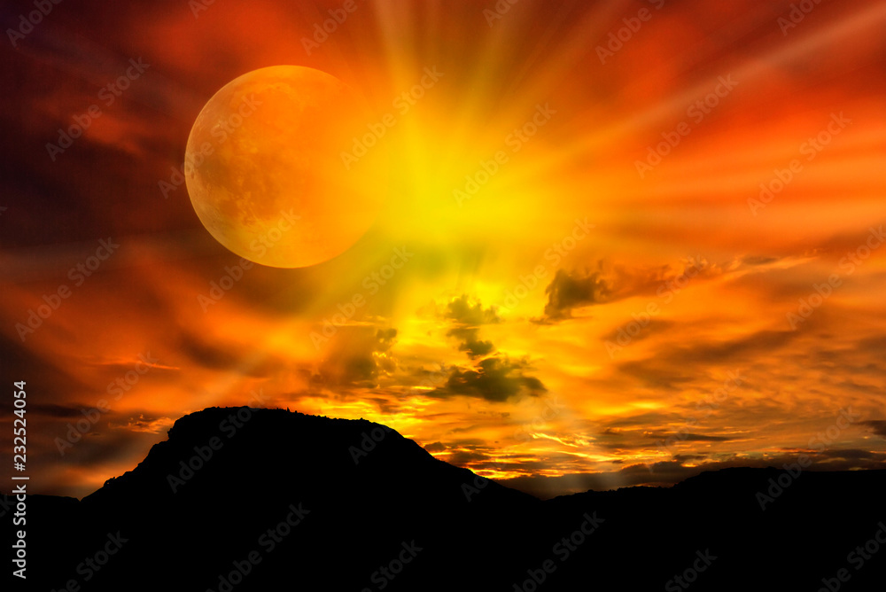 Fototapeta premium Sunset in an eclipse of sun in the mountains