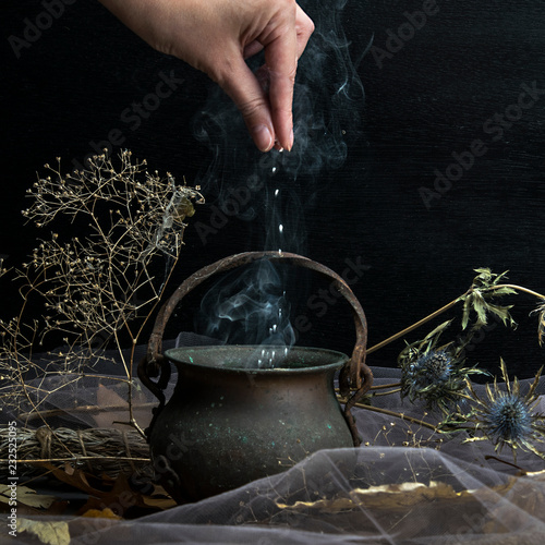 Magic pot of herbs and witchcraft