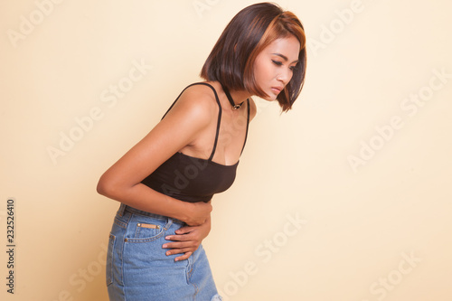 Young Asian woman got stomachache.