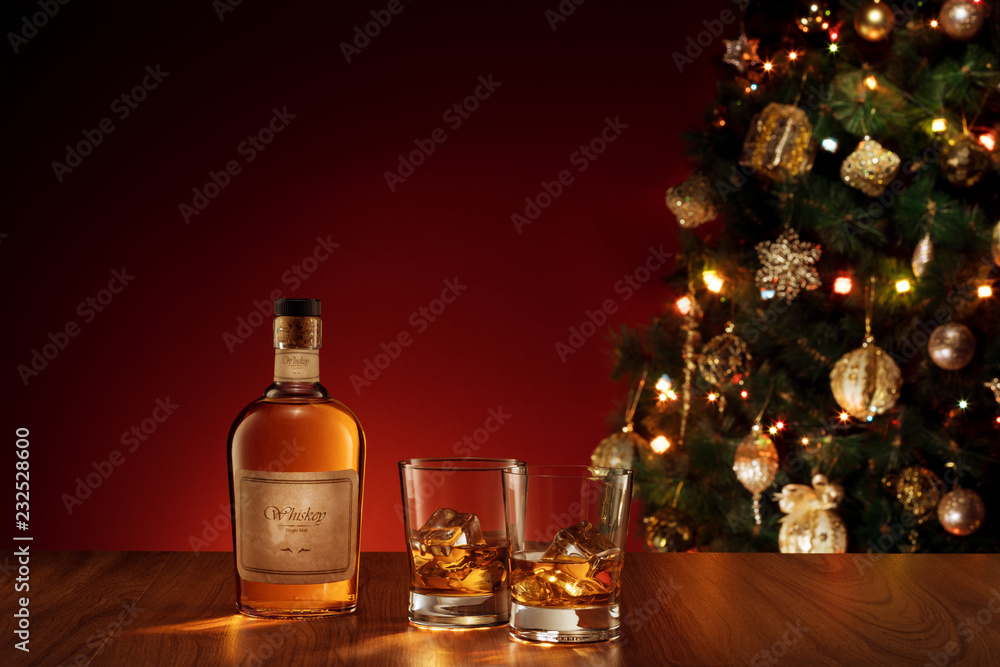 NO LOGO OR TRADEMARK! SELF MADE LABELS! view of glasses with ice and whiskey and a bottle aside. NO LOGO OR TRADEMARK! SELF MADE LABELS! view of glasses with ice and whiskey and a bottle aside.